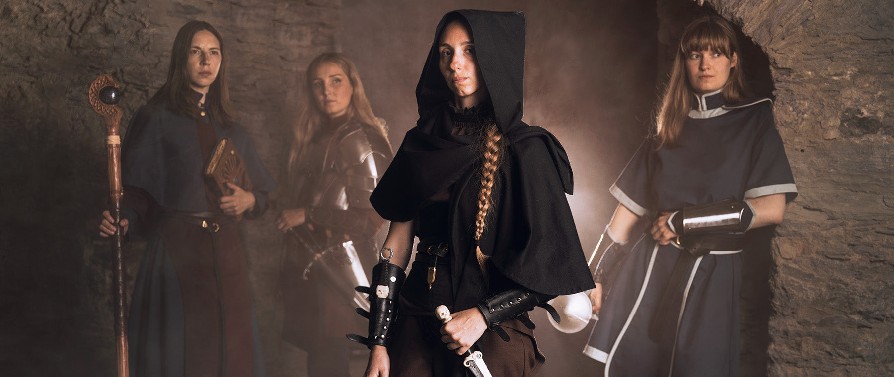 Cleric in a dark blue garb and a large mace. Official Dungeon & Dragon cleric costumes.
